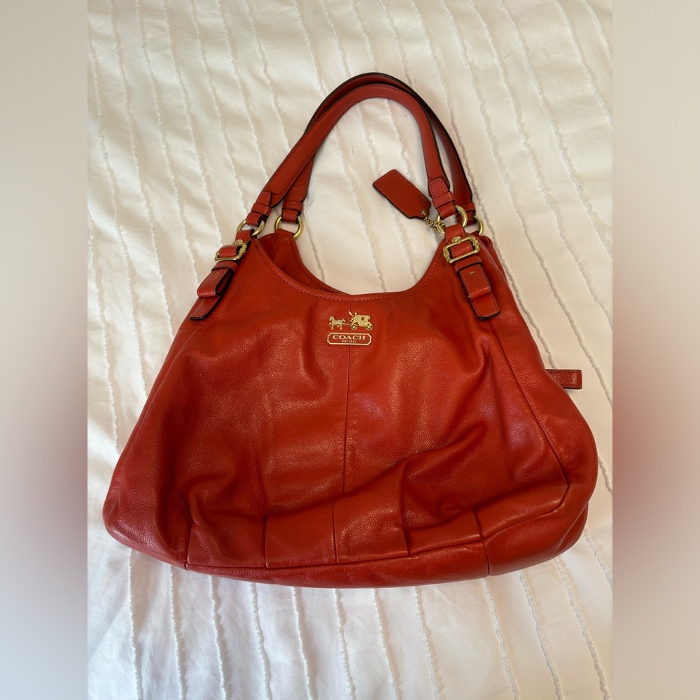 Leather Coach bag. Burnt orange in color and very clean